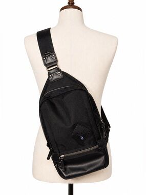 Connect Harvest Label sling backpack- wear on front also. Black w/ red lining.